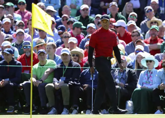  ?? Curtis Compton, Atlanta Journal-constituti­on via The Associated Press ?? Tiger Woods prepares to putt on the second green during the final round of the Masters golf tournament, Sunday, in Augusta, Ga.