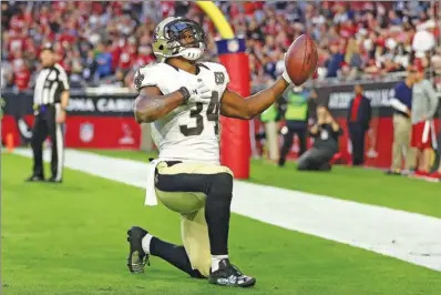  ?? CHRISTIAN PETERSEN / GETTY IMAGES / AFP ?? New Orleans Saints running back Tim Hightower celebrates after scoring a touchdown against the Arizona Cardinals at the University of Phoenix Stadium in Glendale, Arizona, on Dec 18. Hightower has rebounded from a serious knee injury that sidelined him...