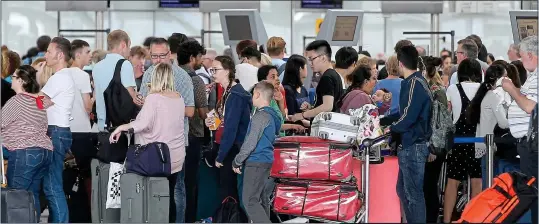  ??  ?? FRUSTRATIO­N: Massive queues formed at Heathrow, above, as the airport ground to a halt and angry passengers were left stranded, below