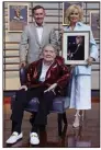  ?? (AP/Mark Humphrey) ?? Music executive Joe Galante (standing) rocker Jerry Lee Lewis, and singer Lorrie Morgan, widow of country singer Keith Whitley, gather Tuesday at the Country Music Hall of Fame in Nashville, Tenn. Morgan is holding a portrait of her late husband.