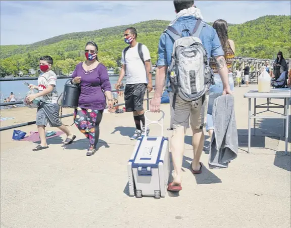  ?? Photos by Paul Buckowski / times union ?? million dollar Beach in Lake George is a popular destinatio­n for local residents and tourists. the tourism industry depends on foreign student workers who will not be coming this year due to an executive order signed by President donald trump last week.