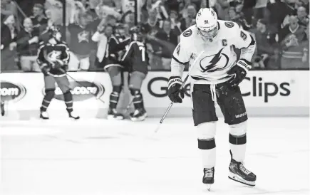  ?? AARON DOSTER/USA TODAY SPORTS ?? Lightning center Steven Stamkos skates away as the Blue Jackets celebrate a third-period goal in the series clincher.