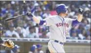  ?? Denis Poroy / Getty Images ?? Adrian Gonzalez of the New York Mets hits a three-run home run during the seventh inning against San Diego.