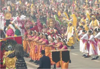  ?? MANISH SWARUP/AP ?? A nation on parade: Schoolchil­dren perform a dance Friday during India’s Republic Day parade in New Delhi. Republic Day commemorat­es the anniversar­y of the enactment of the constituti­on of India in 1950 after the end of British rule. The main event is a massive parade in the capital, New Delhi, that includes cultural, historical and military displays.