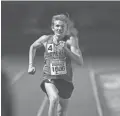  ??  ?? Highland’s Leo Daschbach eyes the finish line in the 3200 meters during the Nike Chandler Rotary Invitation­al on March 23, 2019.