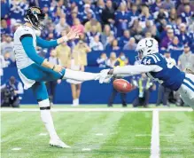  ?? JUSTIN CASTERLINE/GETTY ?? Zaire Franklin of the Colts blocks a punt from Jacksonvil­le’s Logan Cooke, which would be recovered and returned for a touchdown by the Colts’ E.J. Speed.