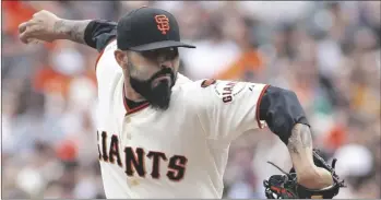  ?? AP PHOTO/GEORGE NIKITIN ?? San Francisco Giants pitcher Sergio Romo throws to the Colorado Rockies during the eighth inning of a baseball game, in 2015 in San Francisco.
