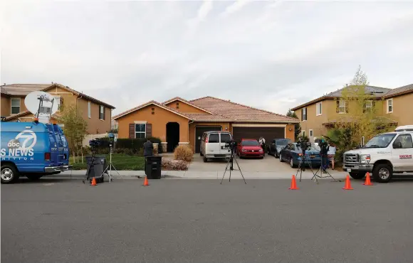  ??  ?? MEMBERS OF THE news media station themselves outside the home of David Allen Turpin and Louise Ann Turpin in Perris, California, last week.