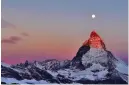  ??  ?? It took Mark Andreas Jones five days of waiting until he could get this sunrise shot of the harvest moon up above the Matterhorn in Switzerlan­d. Worth it!