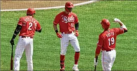  ?? DAVID JABLONSK I / STAFF ?? Tyler Naquin returns to the dugout after leading off the first inning with a home run against the Pirates on Wednesday. Naquin’s emergence has complicate­d the Reds’ outfield picture, but only in a positive way.