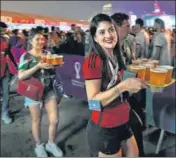  ?? AP ?? Fans carry their beer at a fan zone ahead of the FIFA World Cup in Doha, Qatar on Saturday.*