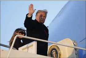  ?? PATRICK SEMANSKY — THE ASSOCIATED PRESS ?? President Donald Trump waves as he boards Air Force One at Andrews Air Force Base, Md., on Wednesday. Trump is traveling to his Mar-a-Lago resort in Palm Beach, Fla.