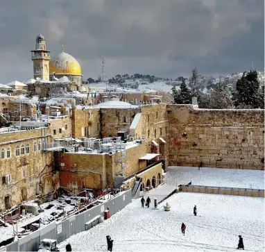  ?? PICTURE: AP ?? HOLY GROUND: The Western Wall, right, and the gilded Dome of the Rock, two of the holiest sites for Jews and Muslims.