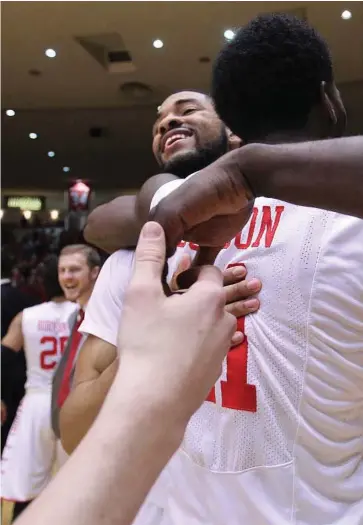  ??  ?? Houston Cougars, including guard LeRon Barnes and guard Damyean Dotson, have had a lot to celebrate this season. They hope to win the American Athletic Conference postseason tournament, which would give them an automatic bid in the NCAA tournament.