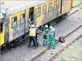  ?? PICTURE: HENK KRUGER/AFRICAN NEWS AGENCY (ANA) ?? As authoritie­s deal with security measures to stop arson attacks on trains in the Western Cape, the City of Cape Town’s Disaster Risk Management Centre yesterday co-ordinated a safety exercise near the Monte Vista railway station that simulated a rail...