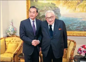  ?? WANG YING / XINHUA ?? State Councilor and Foreign Minister Wang Yi meets with former US secretary of state Henry Kissinger on the sidelines of the United Nations General Assembly in New York on Tuesday.
