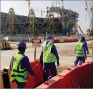  ?? ?? Workers at the site of the Lusail Stadium Doha, 2019