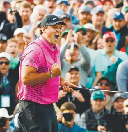  ??  ?? Patrick Reed, a first-time major champion at age 27, celebrates Sunday after winning the Masters.