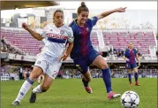  ?? GETTY IMAGES ?? Olympique Lyon’s Delphine Cascarino (left) is tackled by FC Barcelona’s Melanie Serrano during a UEFA Women’s Champions League match in March.