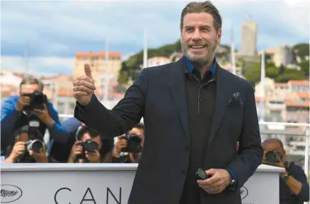  ?? ANNE-CHRISTINE POUJOULAT AGENCE FRANCE-PRESSE ?? John Travolta était d’une simplicité naturelle sur la Croisette mercredi.