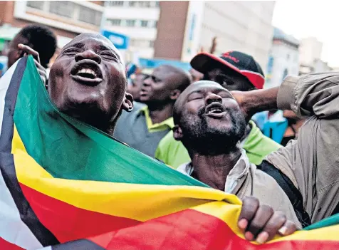  ??  ?? Supporters of Zimbabwean opposition leader Nelson Chamisa’s MDC Alliance cheer at the party’s headquarte­rs in Harare yesterday