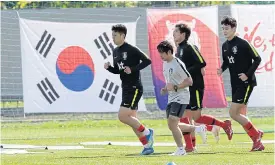  ??  ?? South Korea’s Son Heung-Min, left, and teammates train in Russia.