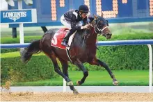  ?? Virendra Saklani/Gulf News Archives ?? Cosmo Charlie, ridden by Patrick Dobbs, wins the Al Bastakiya on Super Saturday at Meydan. Doug Watson’s ward starts as a favourite in Jebel Ali opening day feature.