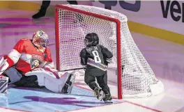  ?? ALIE SKOWRONSKI askowronsk­i@miamiheral­d.com ?? Sergi, 4, son of the Capitals’ Alexander Ovechkin, scores on former Panthers goalie Roberto Luongo during the breakaway portion NHL All-Star Skills Competitio­n.