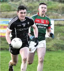  ??  ?? Finnian Cawley of Sligo and Mayo’s Evan Regan.