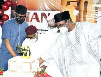  ??  ?? Minister of Industry, Trade and Investment, Adeniyi Adebayo( left); President, Manufactur­ers Associatio­n of Nigeria ( MAN), Mansur Ahmed; Federal Capital Territory ( FCT) Minister, Malam Muhammad Musa Bello and Senator Saidu Ahmed Alkali, during the 50th anniversar­y celebratio­n of MAN in Abuja… at the weekend.