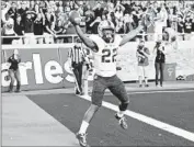  ?? John Weast
Getty Images ?? AARON GREEN reacts after catching the winning touchdown for Texas Christian on a tipped ball.