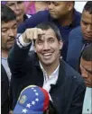  ?? The Associated Press ?? Venezuelan opposition leader Juan Guaido greets supporters in Caracas, Venezuela, on Friday.