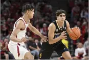  ?? MICHAEL WOODS — THE ASSOCIATED PRESS, FILE ?? San Jose State guard Alvaro Cardenas (13) tries to get past Arkansas forward Trevon Brazile (2) during the first half on Dec. 3in Fayettevil­le, Ark.