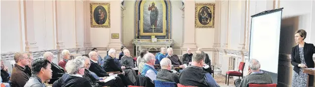  ?? PHOTO: CHRISTINE O’CONNOR ?? Room for improvemen­t . . . Priests from across Otago and Southland listen to Virginia Noonan, the director of the Catholic Church in New Zealand’s National Office of Profession­al Standards (NOPS), during a seminar on safeguardi­ng children, at the Holy Cross Centre in Mosgiel yesterday.