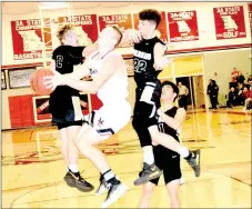  ?? RICK PECK/SPECIAL TO MCDONALD COUNTY PRESS ?? McDonald County’s Peyton Barton gets fouled on a reverse layup attempt amid Neosho’s Brady Wise (2), A.C. Marion (22) and Yeej Lee (1) during the Mustangs 50-44 win on Jan. 26 at MCHS.