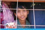  ?? ?? A young Rohingya refugee disembarks from a rescue vessel.