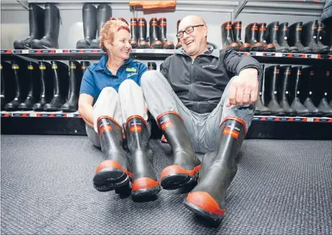  ?? Photo: FAIRFAX NZ ?? Well shod: Skellerup’s South Island sales manager Tony Fuller, right, and CRT saleswoman Lyn Hall at Invercargi­ll’s CRT, which has sold the most gumboots inNewZeala­nd.