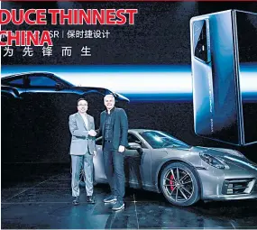  ?? ?? n Honor CEO George Zhao (left) and Porsche Lifestyle Group Chairman of the Executive Board Stefan Buescher.