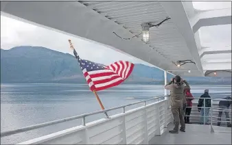  ?? [STEVE STEPHENS/DISPATCH] ?? Passengers enjoy the view from the aft deck of the Fairweathe­r on the Alaska Marine Highway.