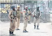  ??  ?? STANDING GUARD: Indian paramilita­ry troops on the lookout in Srinagar ahead of Prime Minister Narendra Modi’s visit to the troubled region.