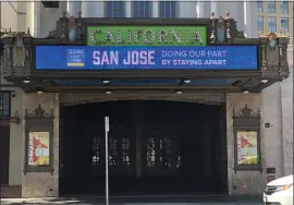  ?? PHOTO BY SAL PIZARRO ?? The California Theatre marquee flashes a sign of encouragem­ent, “San Jose: Doing Our Part by Staying a Part,” during the shelter-in-place order in April.