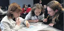  ??  ?? Mapping out answers . . . Logan Park High School team members (from left) Polly Figgins (14), Grace McLaren (13) and Eva Woodhouse (14) brainstorm.