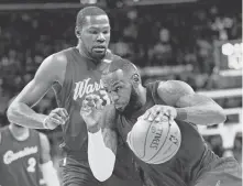  ?? TONY DEJAK/ASSOCIATED PRESS ARCHIVES ?? LeBron James, right, is very familiar with the Warriors’ Kevin Durant. “He’s one of the most dangerous guys we have in the world already,” said James.