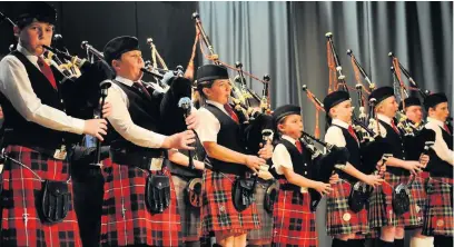  ??  ?? Hitting the high notes
Young pipers wow crowds with their musical talents at last year’s show
