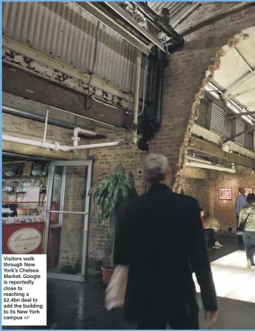  ??  ?? Visitors walk through New York’s Chelsea Market. Google is reportedly close to reaching a $2.4bn deal to add the building to its New York campus