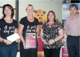  ??  ?? Treasure Your Chest Chix members (from left) Angela Krisel and Katherine Lehmann receive a grant from Drouin and District Community Bank Branch representa­tives Vanessa Marsh (director) and Bruce Sorrell.