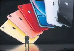  ?? JUSTIN SULLIVAN GETTY IMAGES ?? Apple CEO Tim Cook announces the new base-model iPhone 11, which comes in multiple colours. It’s an upgrade to the current iPhone XR, and keeps its look.