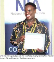  ??  ?? Danelle Fraser proudly holds her certificat­e of completion of the Women’s Leadership and Advocacy Training programme.