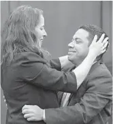  ?? PHELAN M. EBENHACK/ORLANDO SENTINEL ?? Clemente Aguirre, right, is congratula­ted by attorney Nina Morisson of the Innocence Project after he was exonerated of all charges in the 2004 murders of Carol Bareis and Cheryl Williams, on Monday in Sanford.