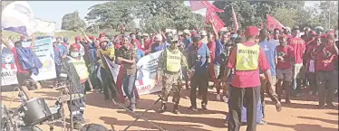  ?? ?? TUCOSWA marshals had a hard time trying to control members of SWALIMO and CPS who were singing and dancing in front of the stage while TUCOSWA leadership was addressing the attendees. Some EFF Swaziland members also joined them.